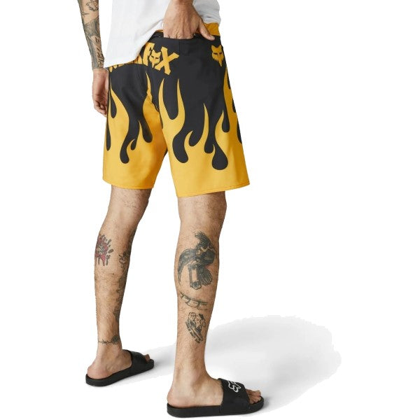 Short de Surf Supr Trik Noir/Jaune incliné de dos à gauche